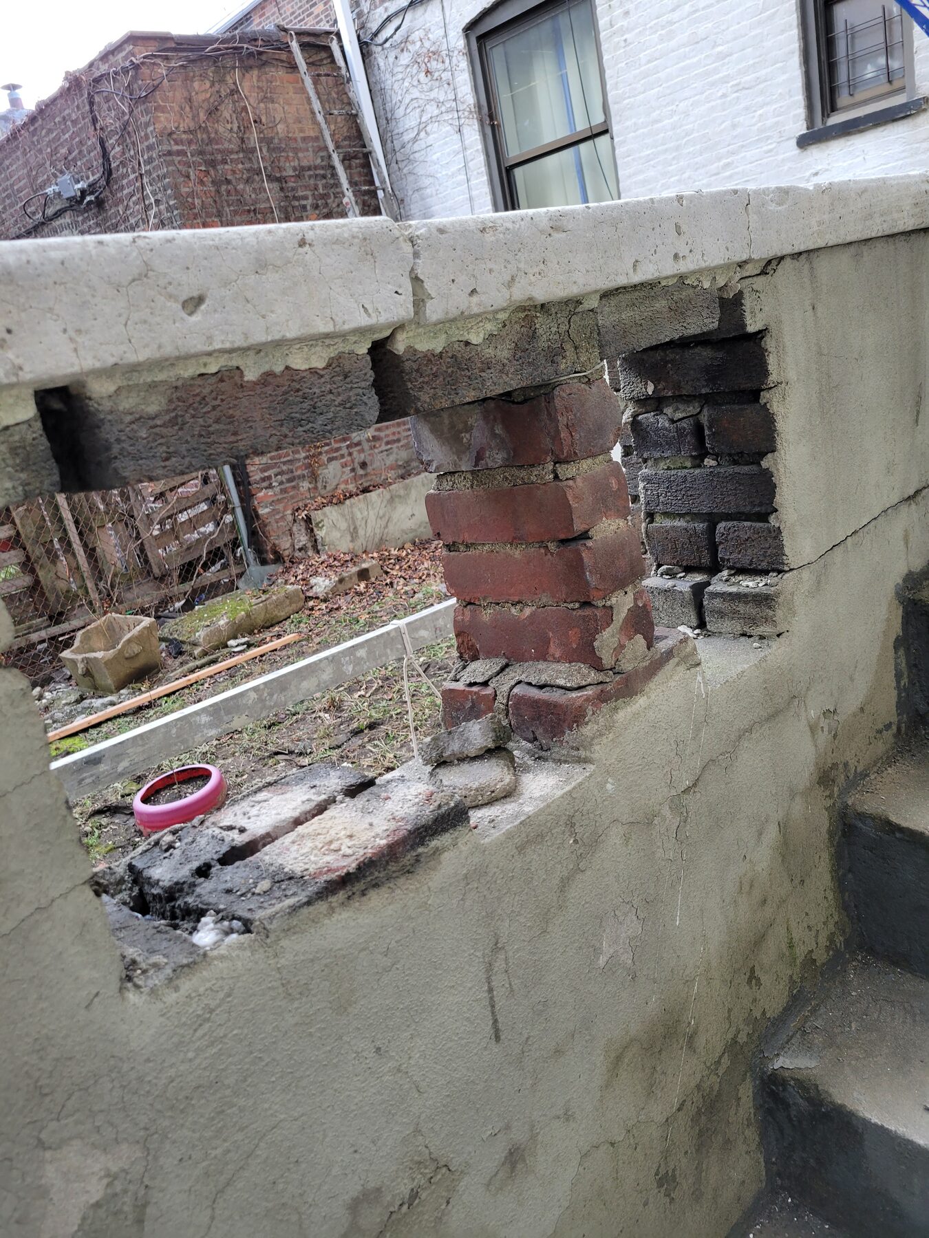 Parapet wall with broken and missing bricks, structural risk, Crown Heights, Brooklyn