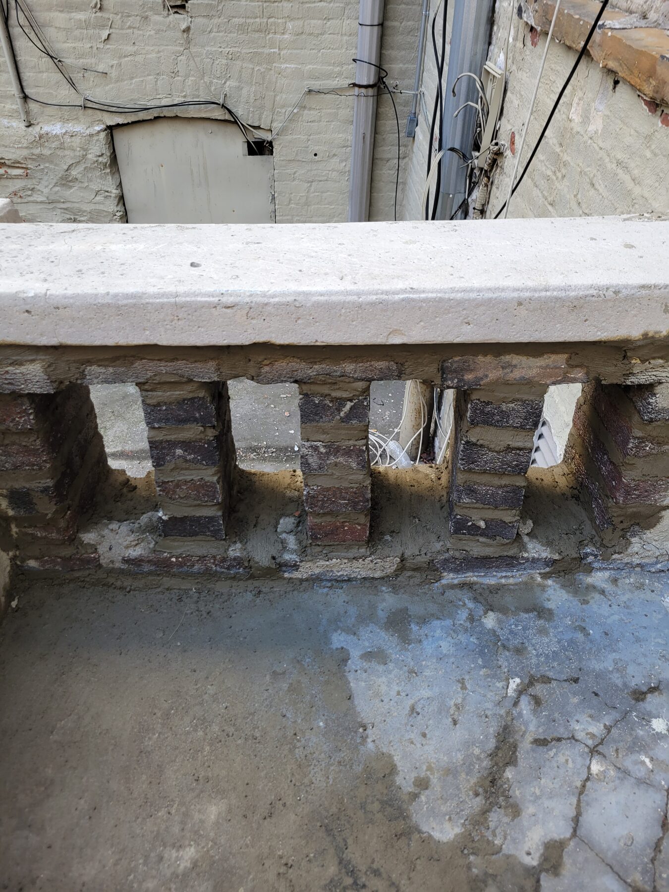 Close-up of missing brick section in parapet wall, Crown Heights, Brooklyn