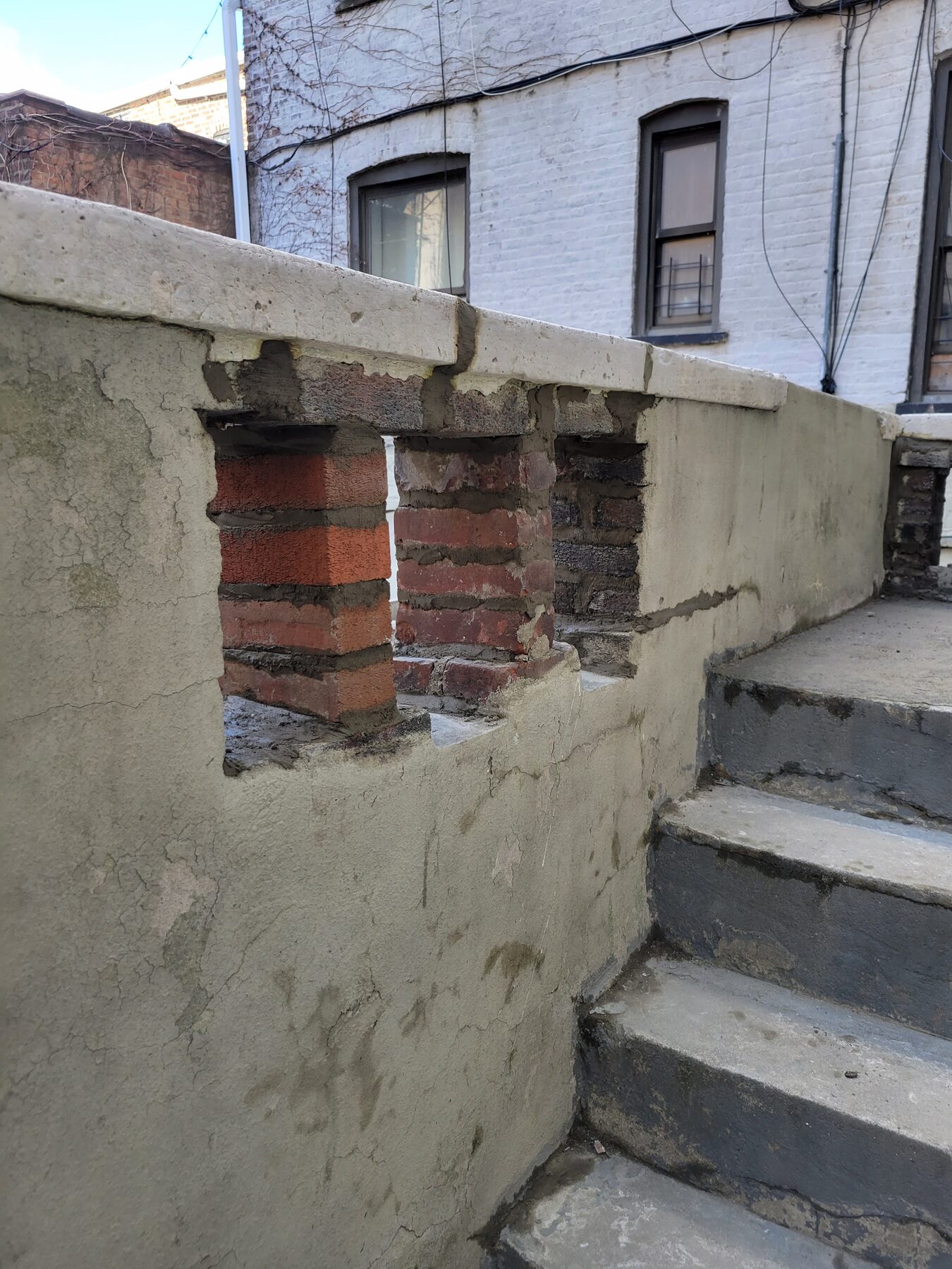 New brick being installed to rebuild damaged parapet wall, Crown Heights, Brooklyn