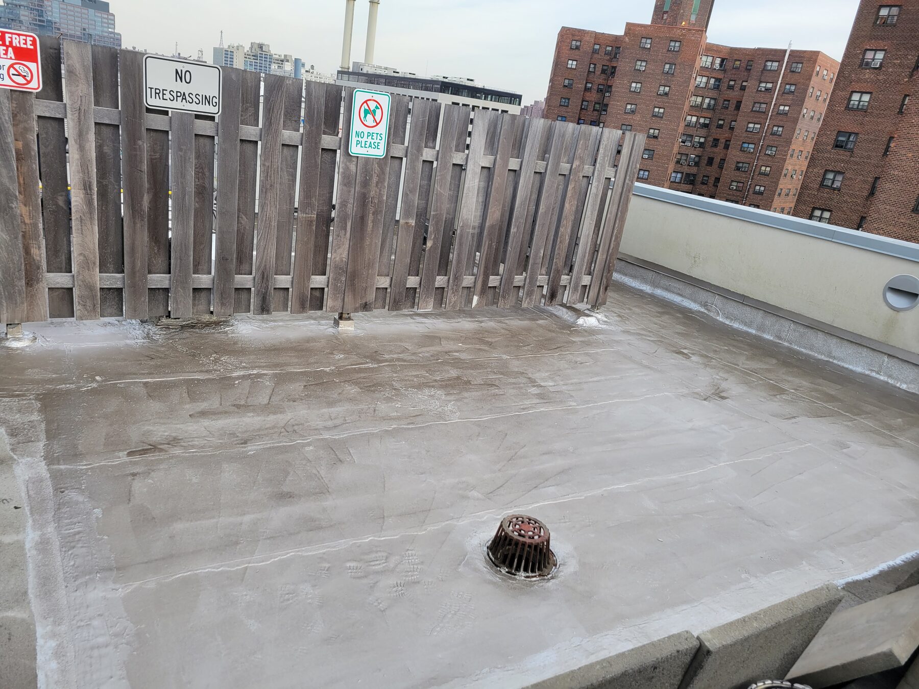 New protective roof coating applied over repaired membrane, Brooklyn Heights, Brooklyn