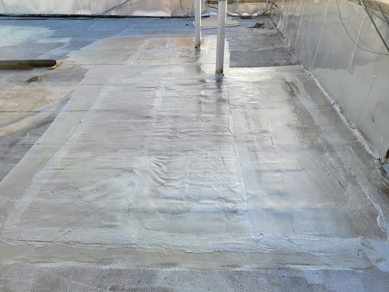 Finished reflective roof coating after same-day emergency repair, Harlem, Manhattan