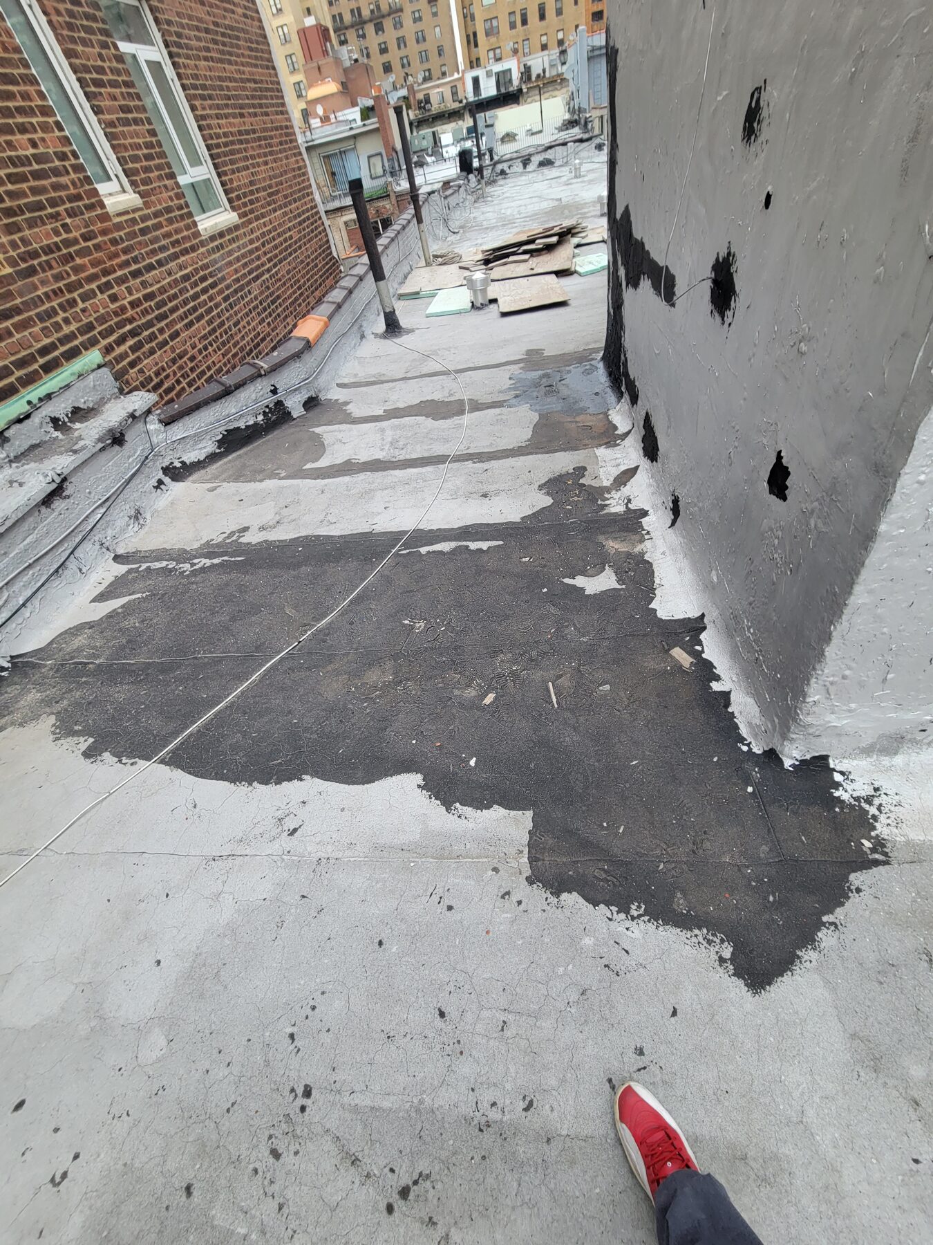 Aging, cracked roof membrane before full roof replacement, Upper West Side, Manhattan
