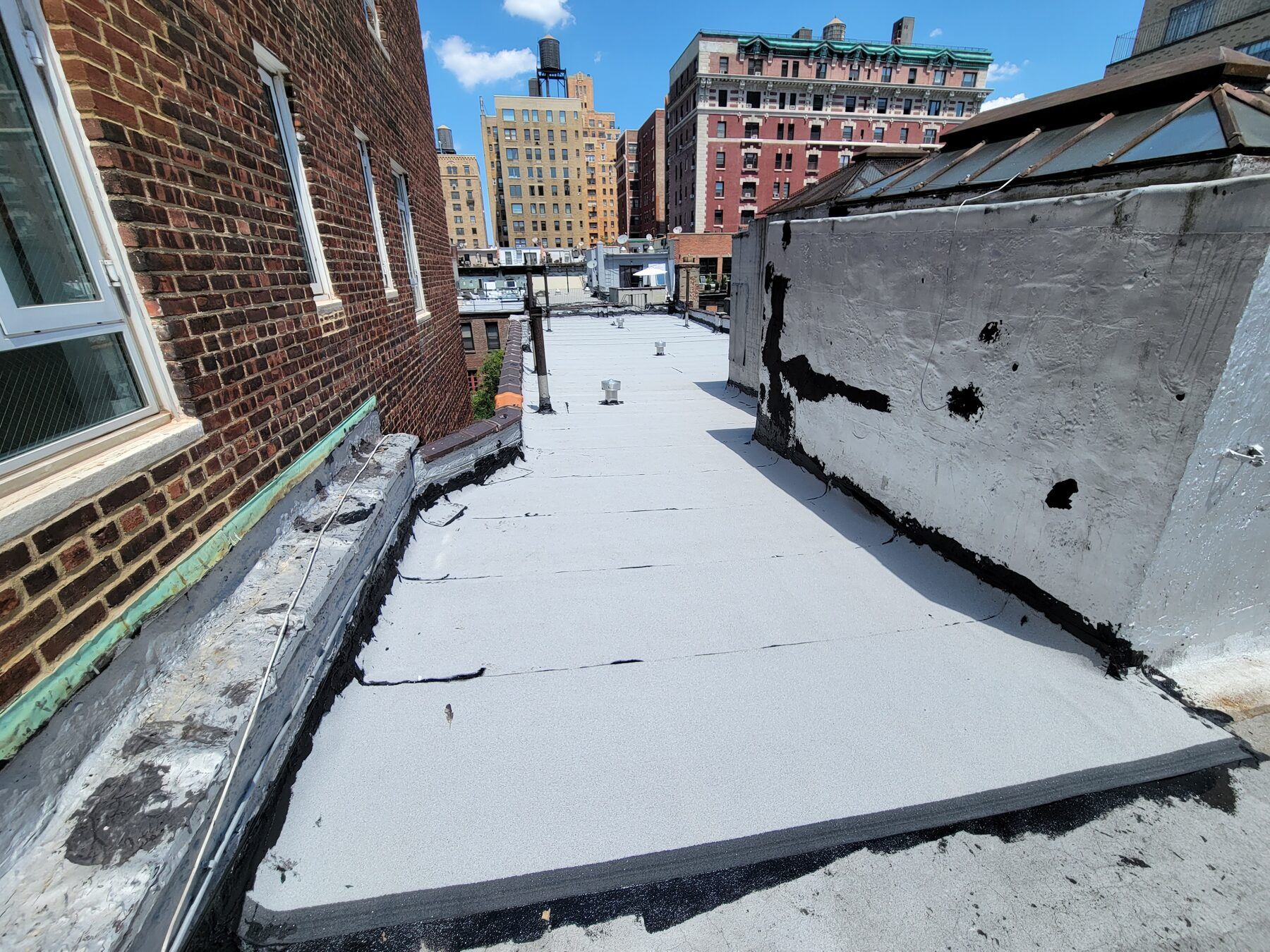 Completed white asphalt roof, Upper West Side, Manhattan