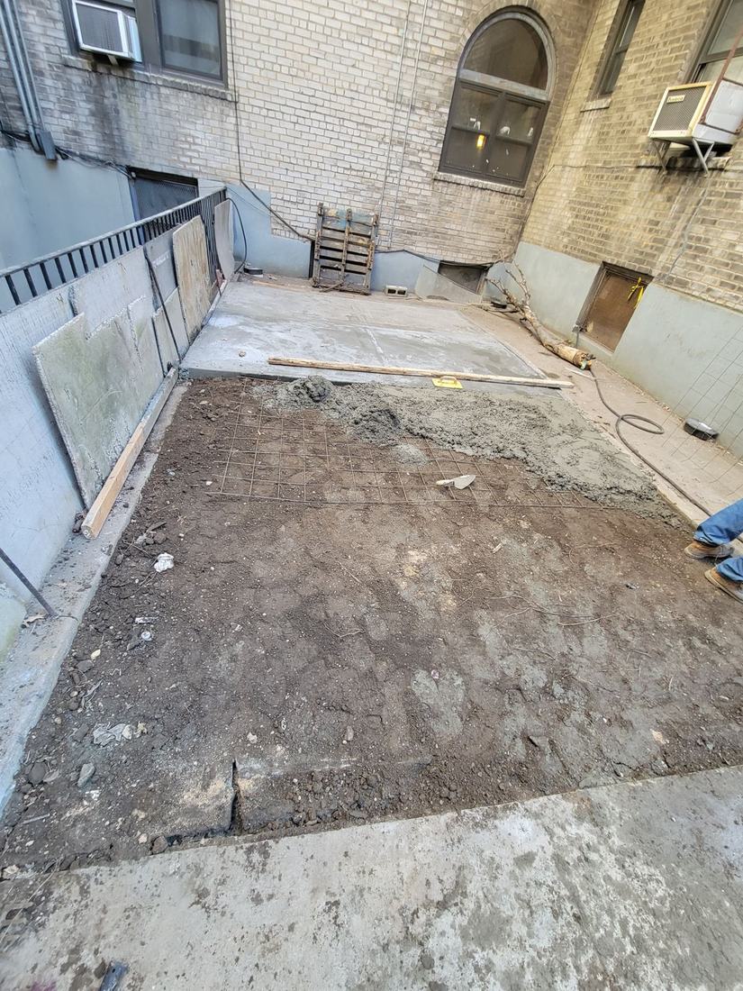 Rebar grid and concrete pour in progress