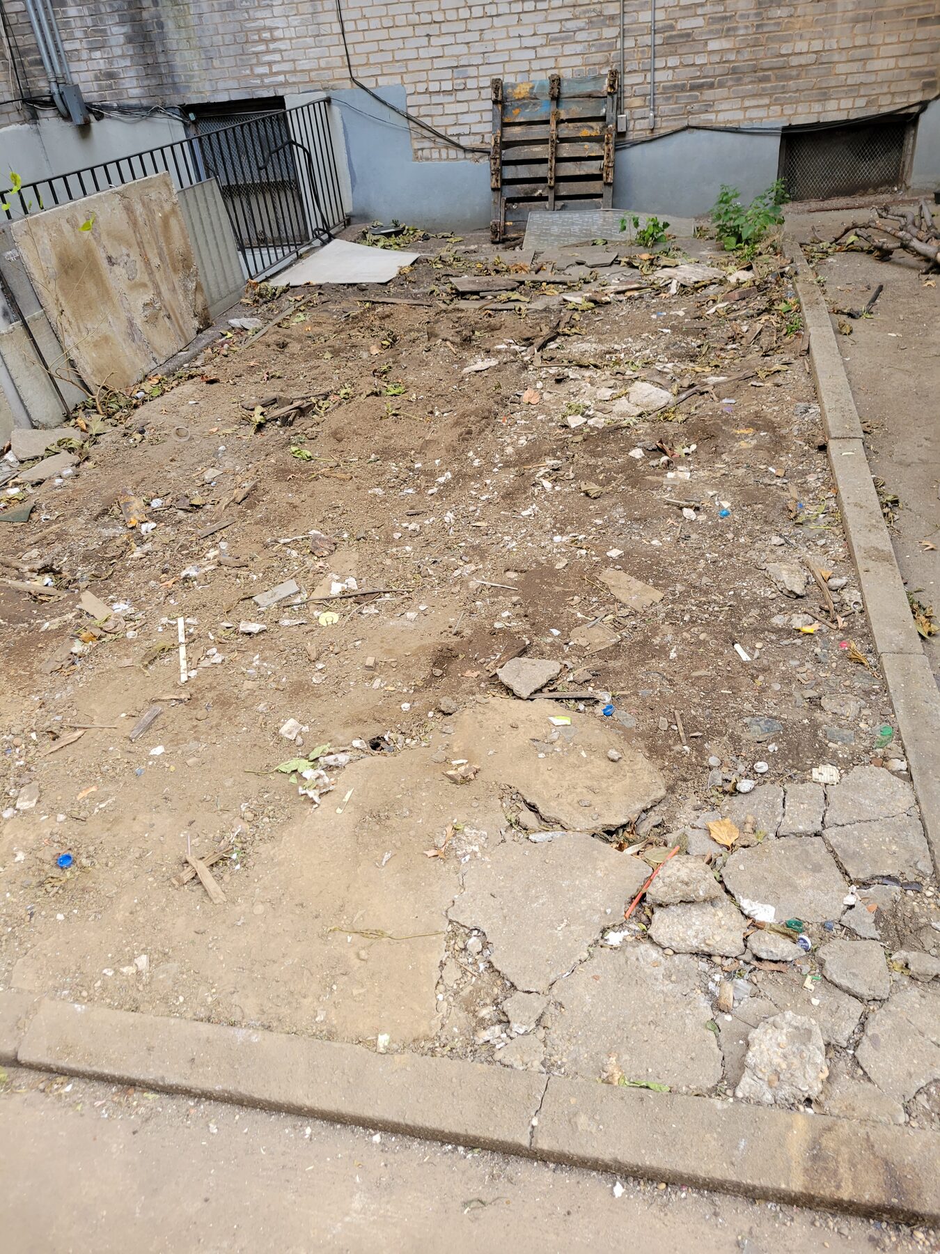 Old broken concrete slab demolished down to subgrade, Astoria, Queens