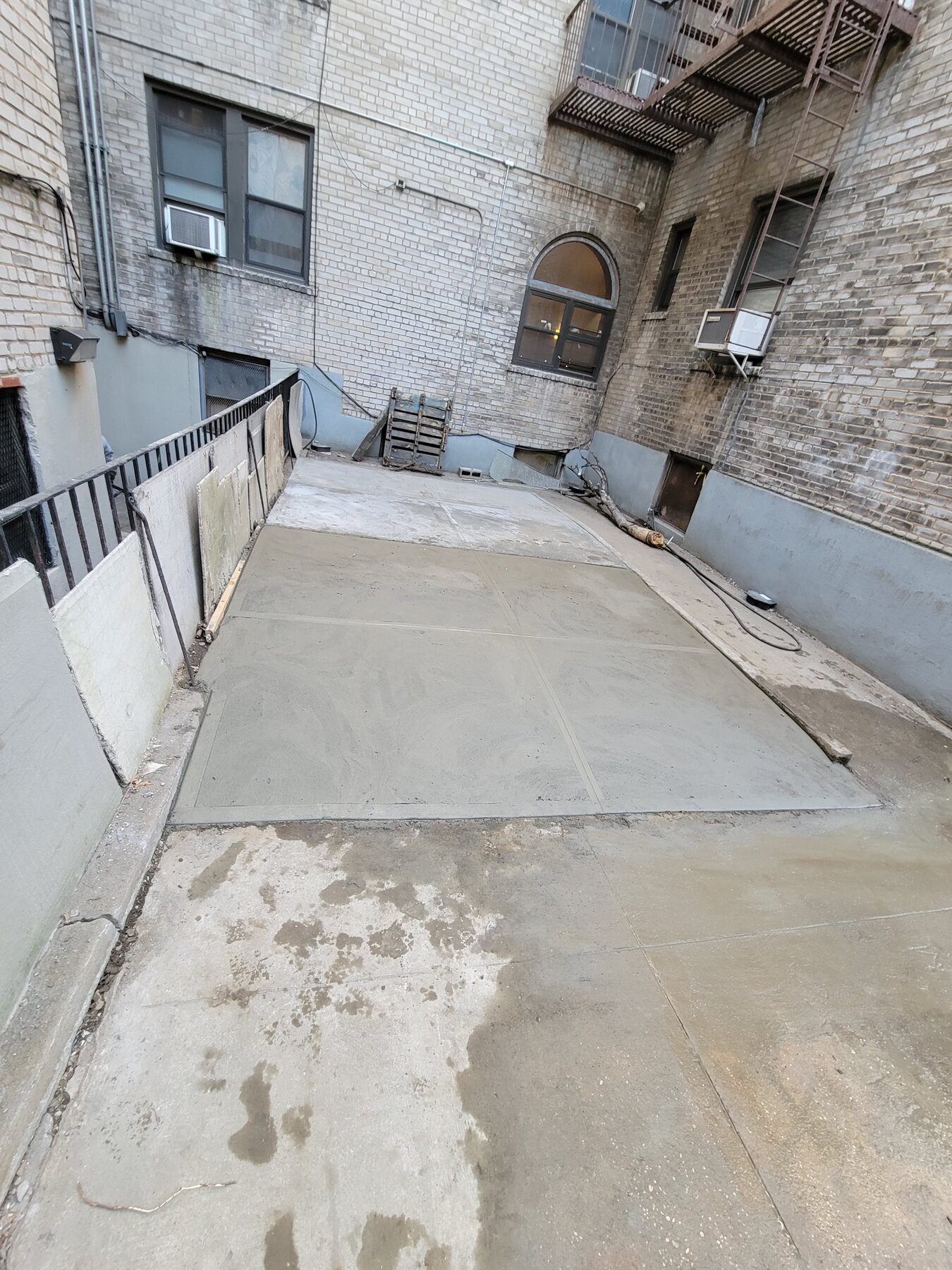 Completed new concrete courtyard slab, Astoria, Queens